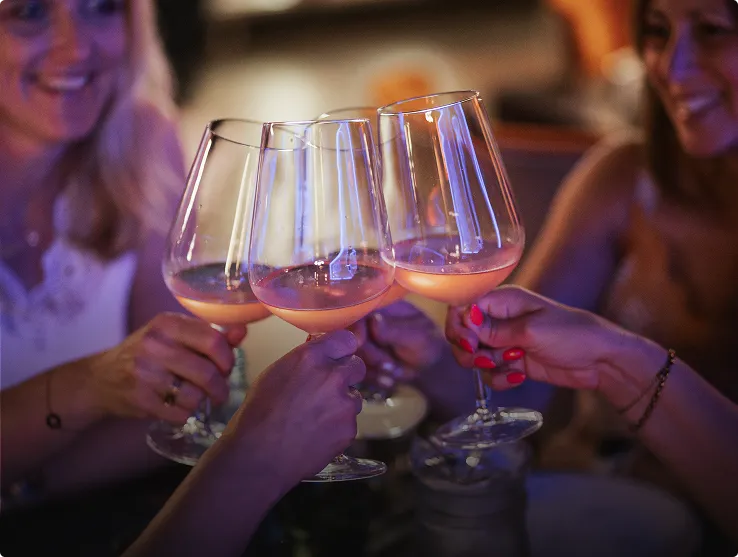 Glasses raised in a toast during dinner at Tango
